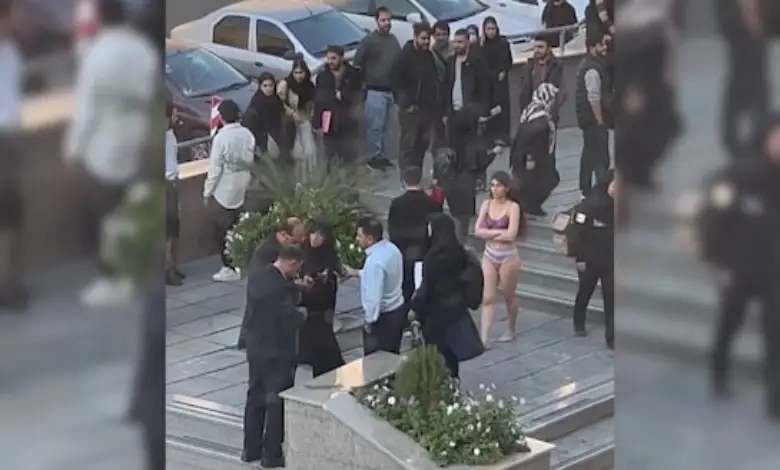 Student takes off her clothes in Iran University