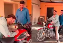 ms dhoni rides fan's royal enfield bike after signing autograph