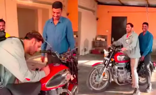 ms dhoni rides fan's royal enfield bike after signing autograph