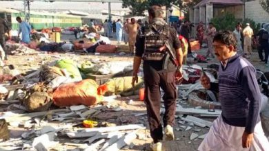 emergency responders at pakistan railway station after blast