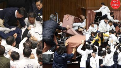 Taiwan parliament in turmoil as opposition party storms speaker's chair."