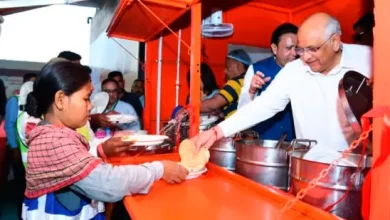 Workers enjoying a meal provided under a government scheme for five rupees