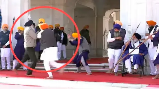 Police apprehending man who attempted to shoot Sukhbir Badal at Golden Temple