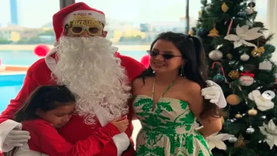 MS Dhoni sports Santa Claus look with Sakshi and Ziva