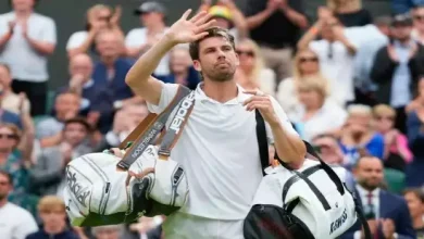 Cameron Norrie's racket slips and hits a spectator at the Auckland Open.