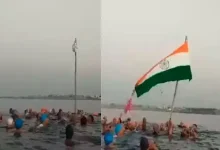 swimming club members hoist tricolor in sea porbandar