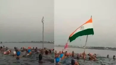 swimming club members hoist tricolor in sea porbandar