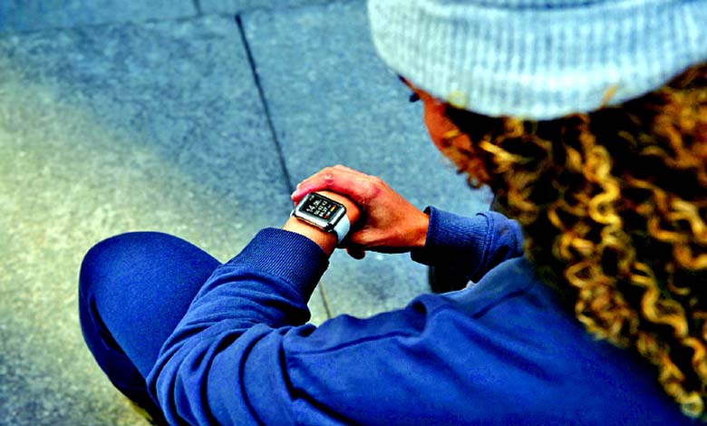 Young radical   utilizing smartwatches during outdoor activities