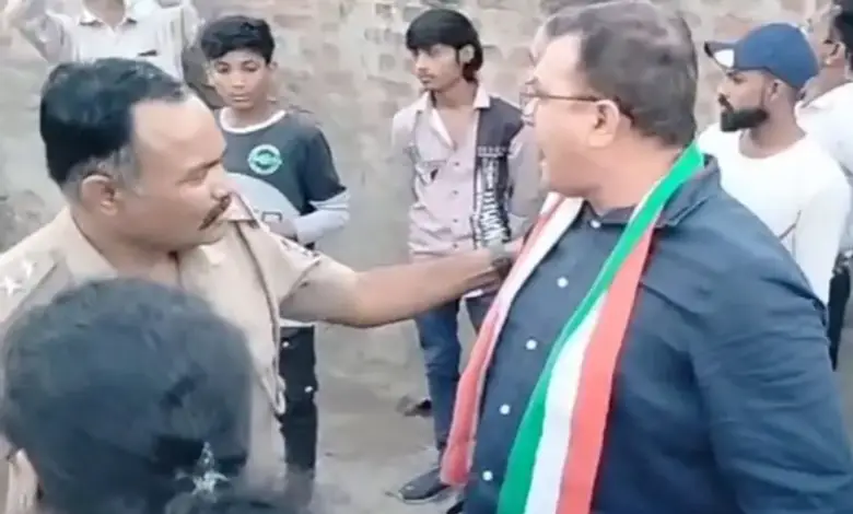 "Congress leader Pratap Dudhat confronting BJP supporters during an election campaign rally in Chalala, Amreli."