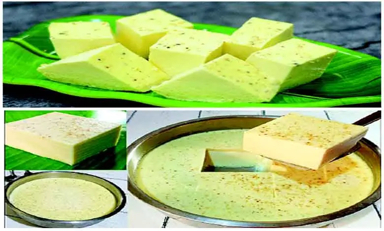 A plate of soft and creamy kharvas (junnu) garnished with nuts, ready to serve.