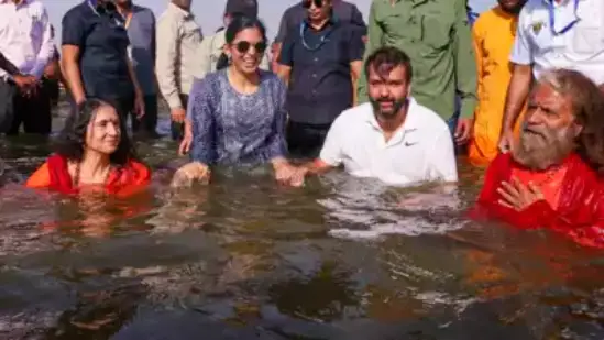 isha ambani takes holy dip in sangam with husband anand piramal