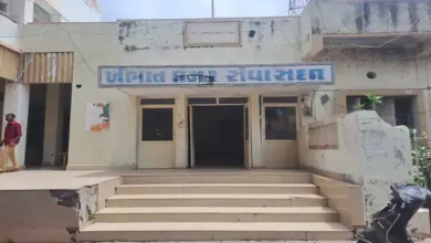 "Khambhat Municipality office with documents and magnifying glass highlighting scam investigation"