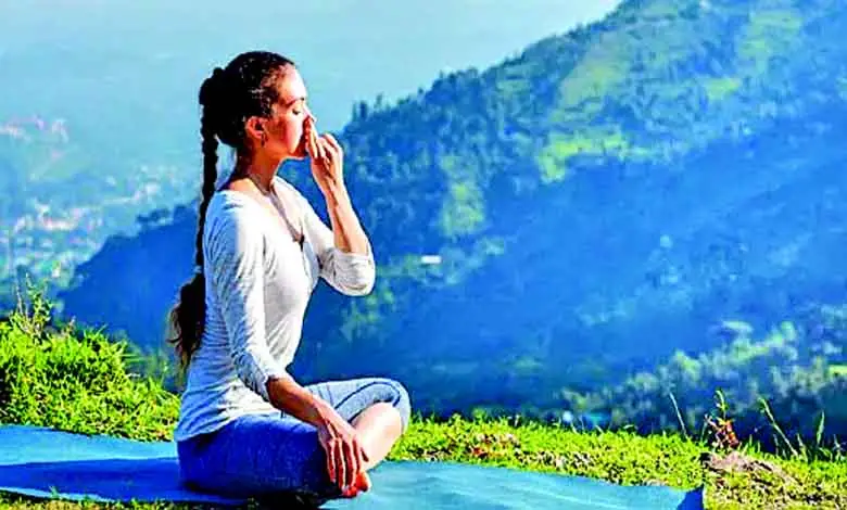 A person practicing pranayama in a serene environment, showcasing the health benefits of controlled breathing.