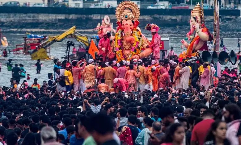 "Massive POP idol immersion at Girgaon Chowpatty beach with municipal and police authorities absent."