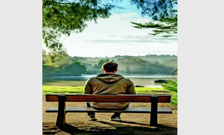 Person meditating peacefully in a natural setting, symbolizing slow living philosophy.