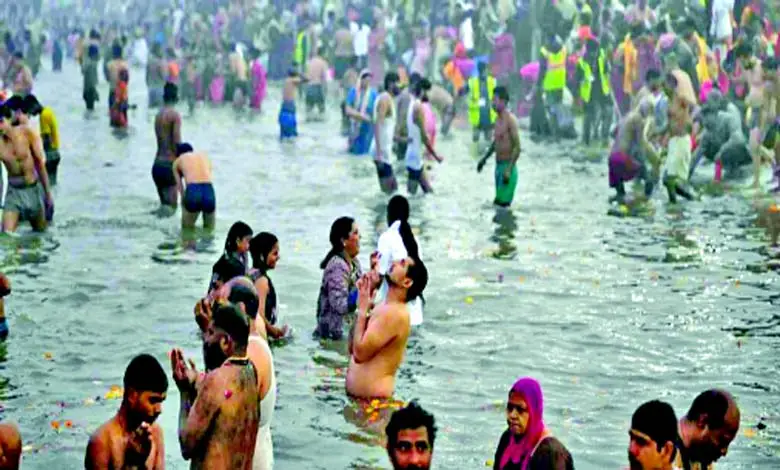 A person performing a spiritual bathing ritual near a river, symbolizing purity and devotion.