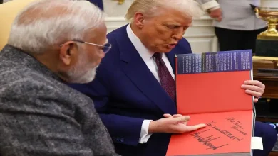 "Trump handing a special gift to Modi with a note saying 'Mr Prime Minister, you are great' at a public event."