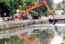 Workers cleaning a drain in Mumbai ahead of monsoon season