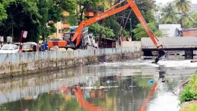 Workers cleaning a drain in Mumbai ahead of monsoon season