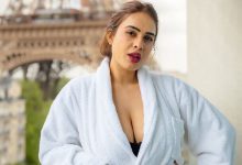 Neha Malik in a bathrobe strikes a killer pose on a balcony in Paris