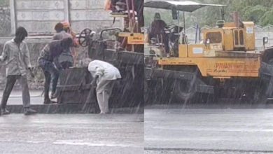 "Rajkot Municipal Corporation Builds Road in Heavy Rain"