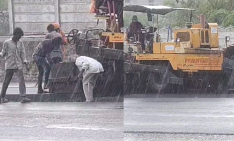 "Rajkot Municipal Corporation Builds Road in Heavy Rain"