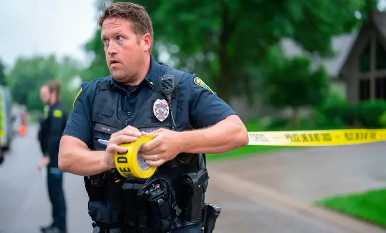 Police tape and emergency vehicles outside a residential home in Minnesota after a shooting incident.