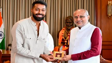Hardik and Krunal Pandya gifting an autographed bat and India jersey to Maharashtra Governor C. P. Radhakrishnan