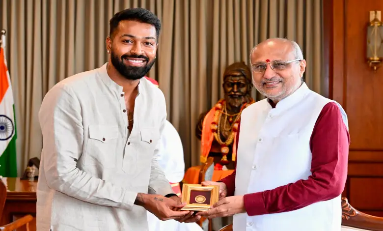 Hardik and Krunal Pandya gifting an autographed bat and India jersey to Maharashtra Governor C. P. Radhakrishnan
