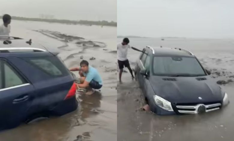 Mercedes stuck on Dumas Beach in Surat, crane had to be called to pull it out