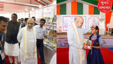 What did Amit Shah write on the register wall at the Ahmedabad International Book Festival?