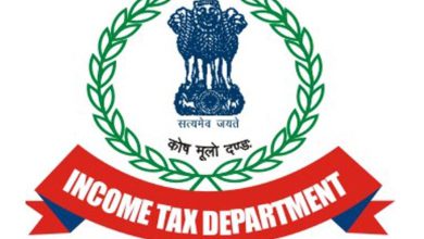 Which political parties in Gandhinagar were raided by Income Tax?