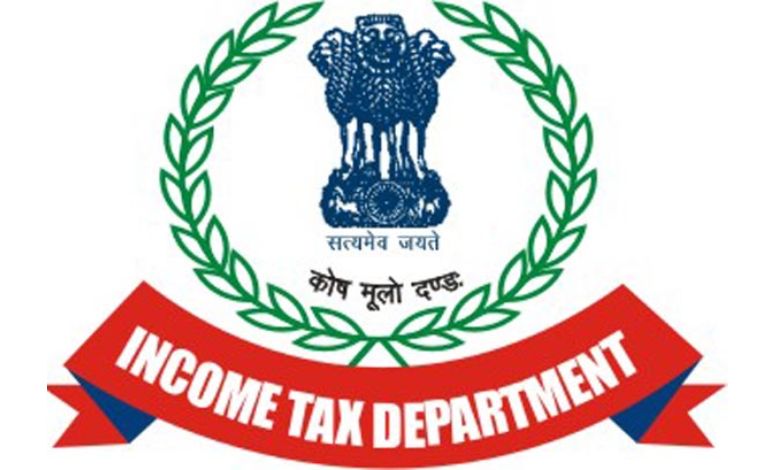 Which political parties in Gandhinagar were raided by Income Tax?