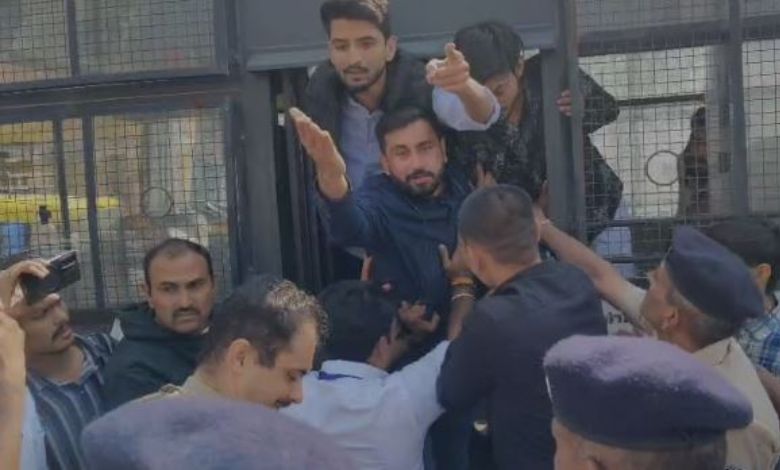 NSUI activists staging a fierce protest during the Chief Minister's program in Rajkot against the mandatory inclusion of teachers in the SIR (Special Intensive Revision) voter list exercise.