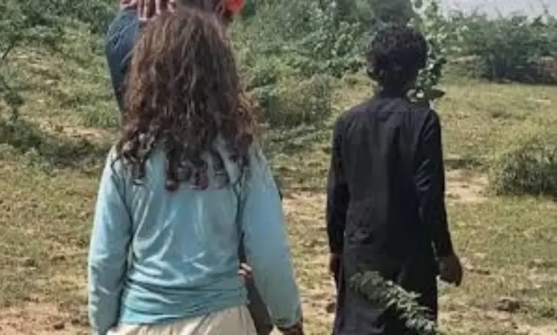 BSF personnel detain a Pakistani couple during an infiltration incident at the India-Pakistan border near Kutch.