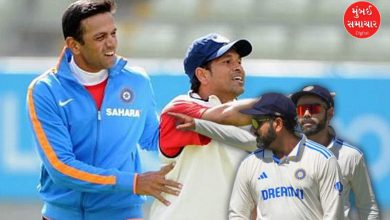 રોહિત શર્મા અને વિરાટ કોહલી ક્રિકેટ મેદાન પર એકબીજાની સાથે ઊભા છે.