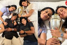 World champions strike a unique pose with the cherished trophy