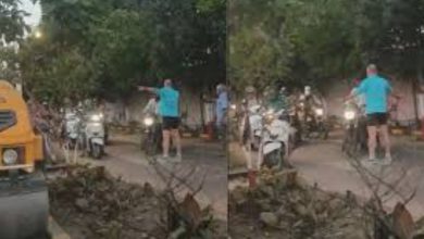 Foreign nationals managing traffic at a busy junction in Pune