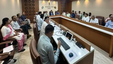 Gujarat election officials discussing SIR digitalization progress during a meeting with political party representatives