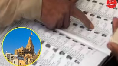 Voters checking names at polling station in Dwarka