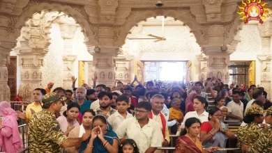 Devotees standing in long queues at famous Indian temples
