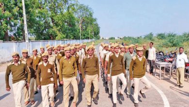 Gujarat Home Guard personnel standing in formation during a state parade.