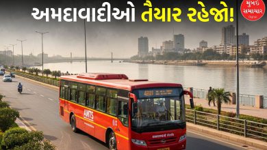 An AMTS bus passing through the iconic Sabarmati Riverfront road in Ahmedabad.
