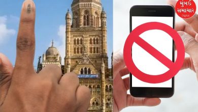 Voters standing in queue at a polling station in Mumbai.