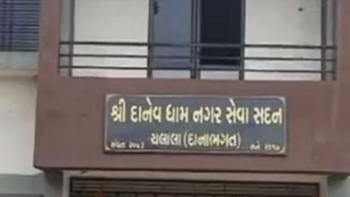 MLA J.V. Kakadia and BJP workers congratulating Bhumiben Vala with sweets and flowers.