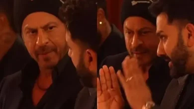 ઇવેન્ટમાં એકબીજા સાથે વાતચીત કરી રહેલા રોહિત શર્મા અને શાહરુખ ખાન.