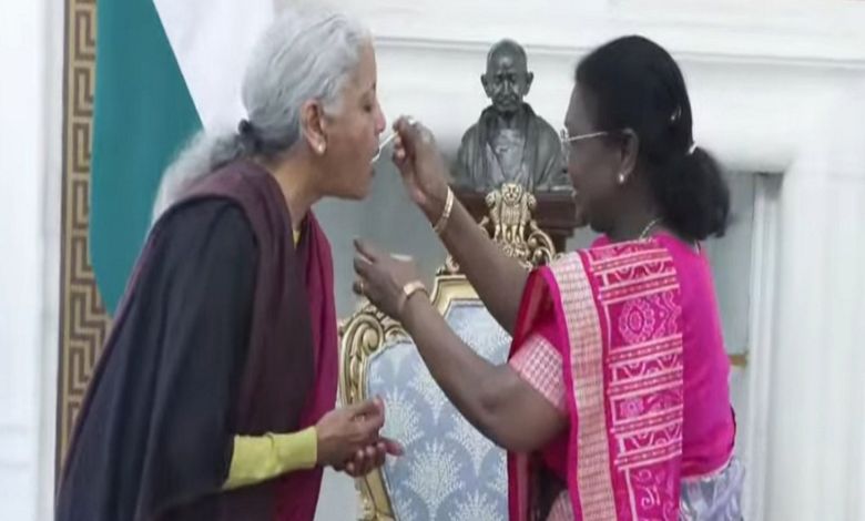 President Droupadi Murmu offering curd and sugar to Finance Minister Nirmala Sitharaman at Rashtrapati Bhavan.