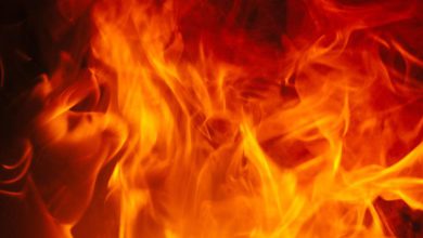 Thick black smoke billowing from a furniture factory in Palghar industrial area with fire engines present