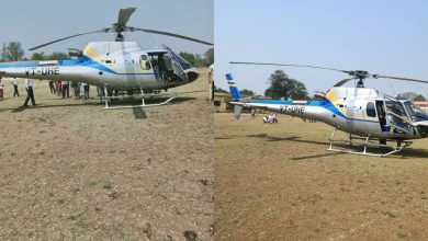 A private helicopter parked in an open field at Kelve Road after an emergency landing.