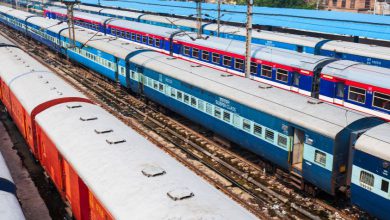 Indian Railways WAP-7 locomotive hauling a passenger train at a station.